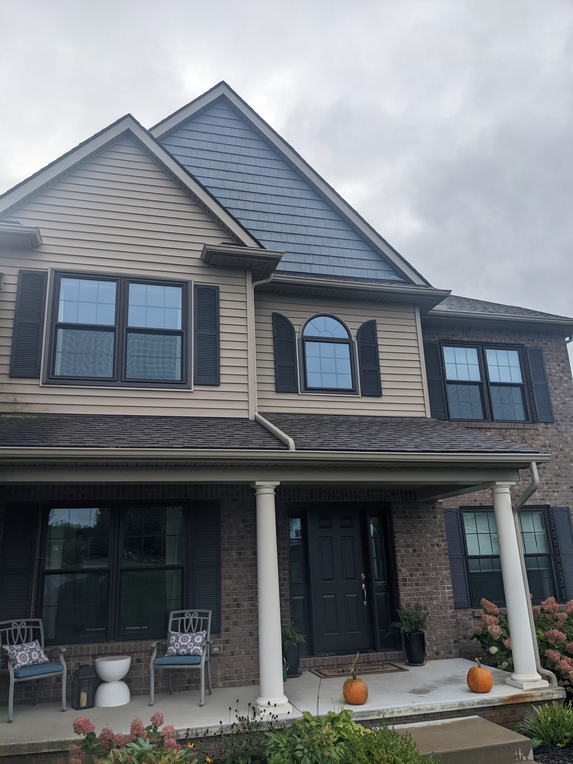 Front of home with all new entry door and windows