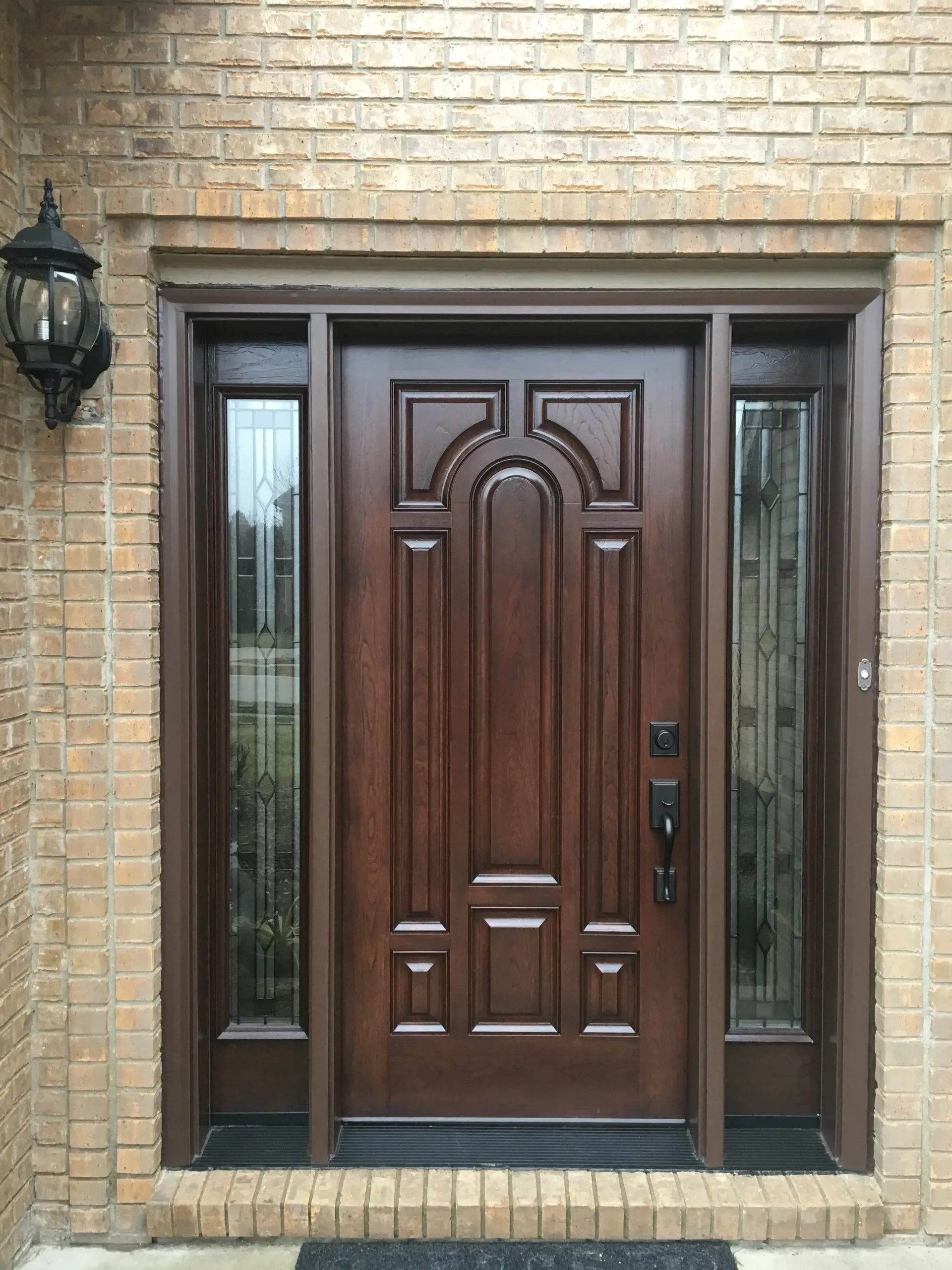 New wood entry door with decorative glass sidelights