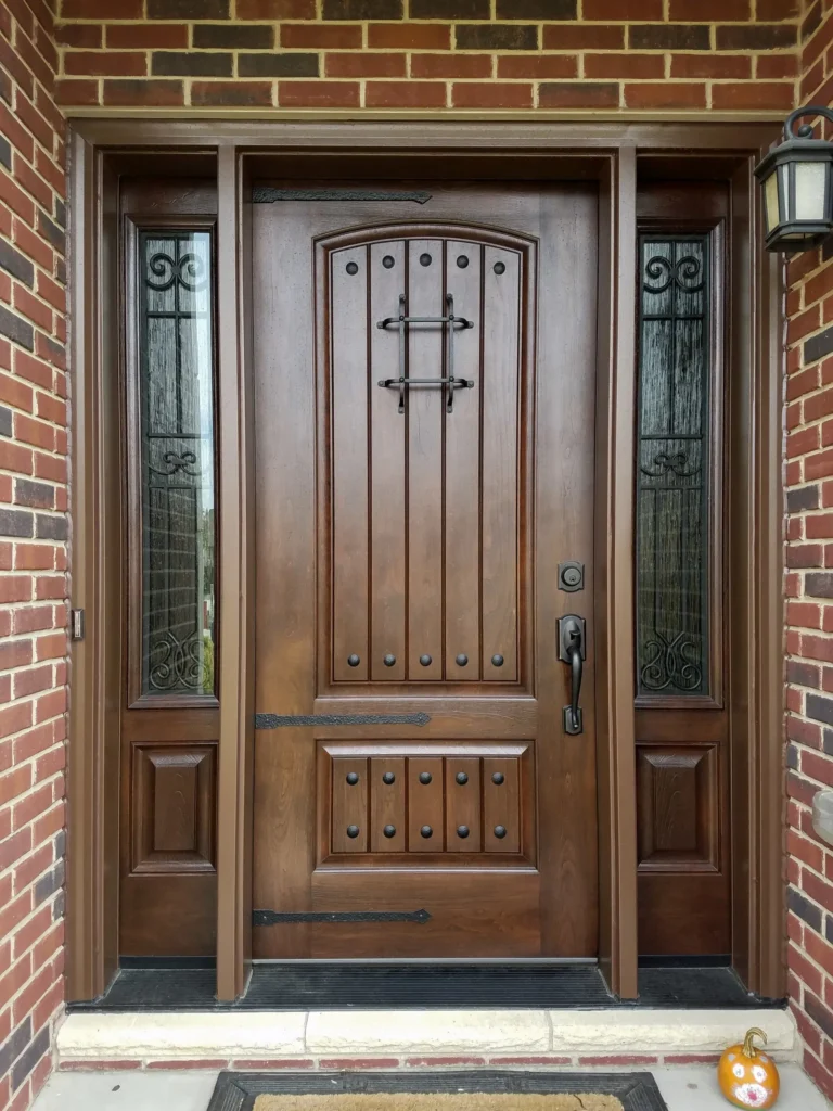 New wood entry door with decorative glass sidelights