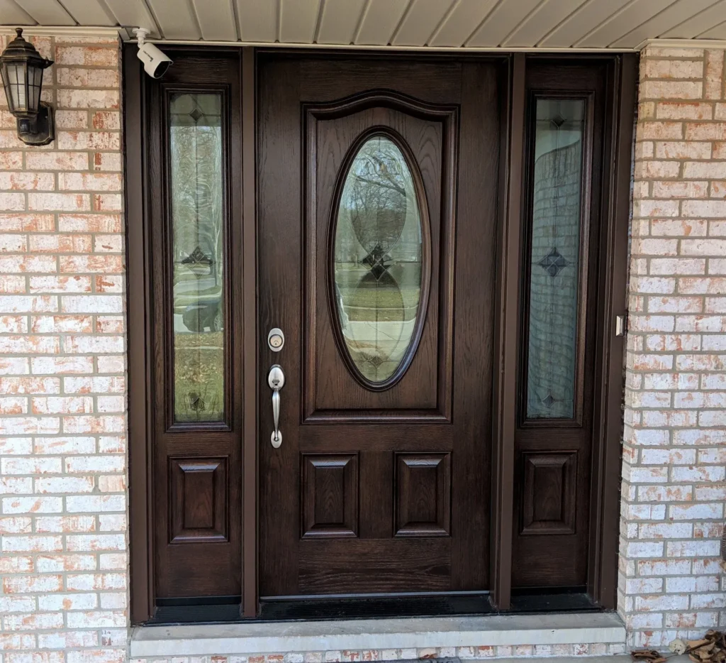 New wood entry door with decorative glass and sidelights