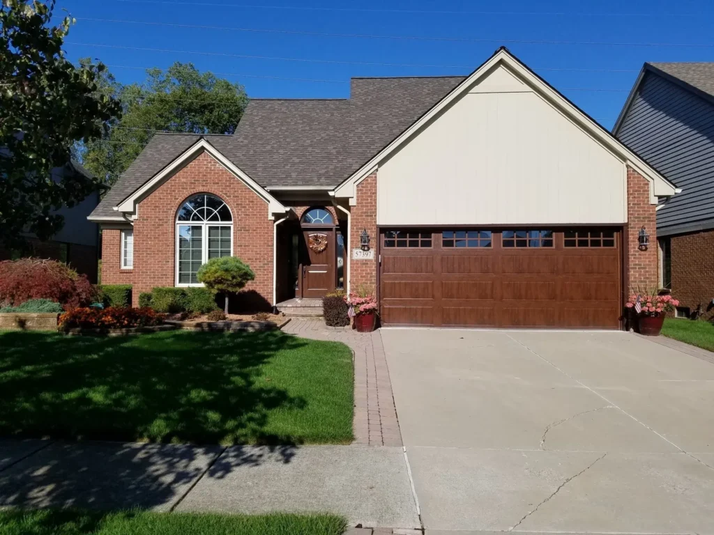 Brown wood garage door and entry door