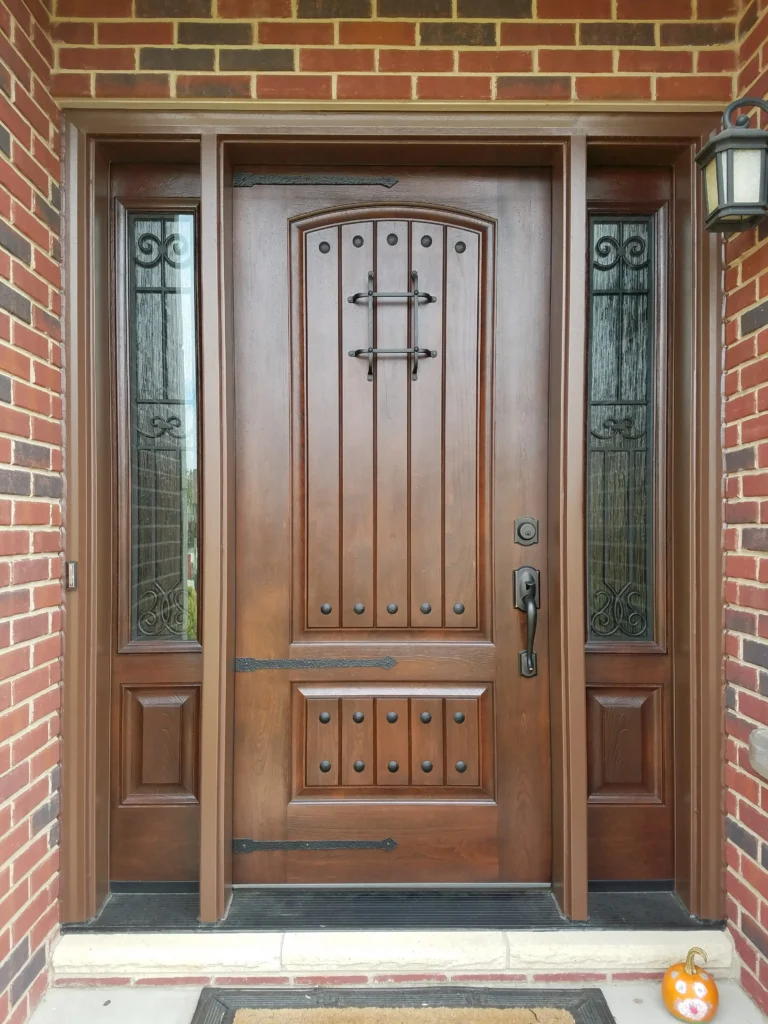 New entry door with decorative glass sidelights