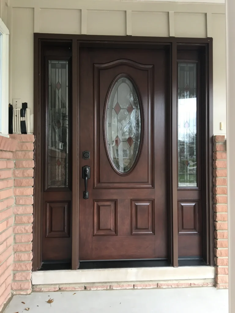 New entry door with decorative glass and sidelights