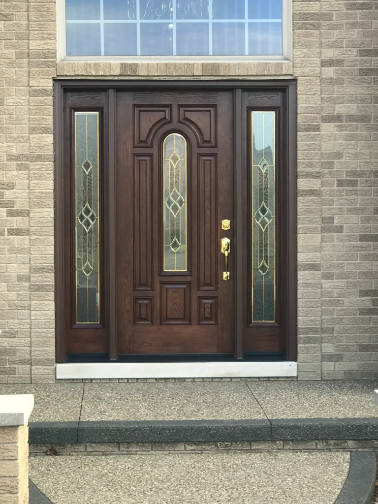 New entry door with decorative glass and sidelights