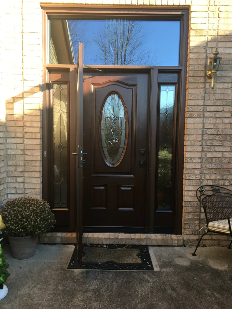 New entry door with decorative glass and sidelights