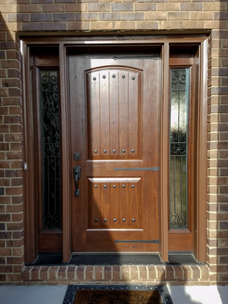 New entry door with decorative glass sidelights