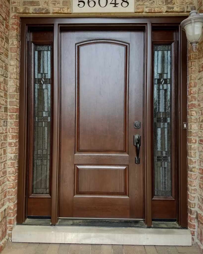 New entry door with decorative glass sidelights