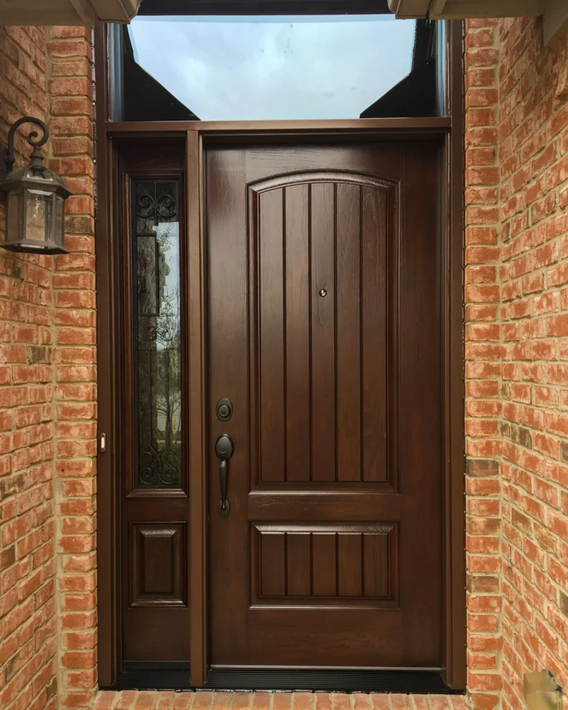 New wood entry door with decorative glass sidelight and transom