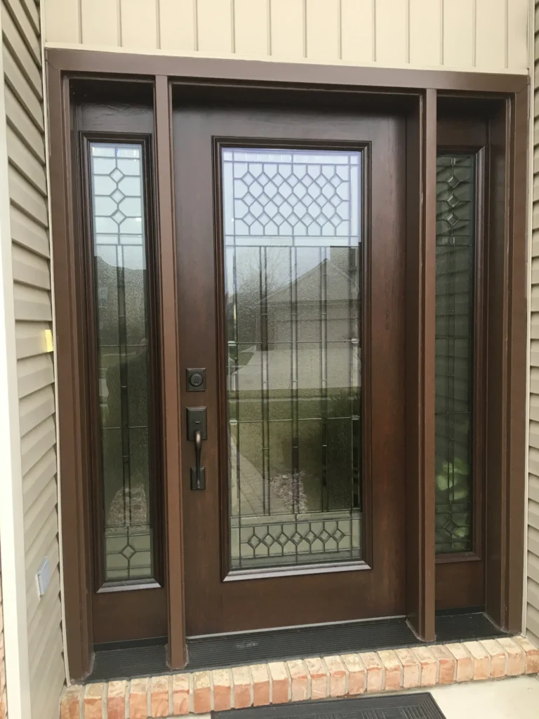 New wood entry door with decorative glass and sidelights