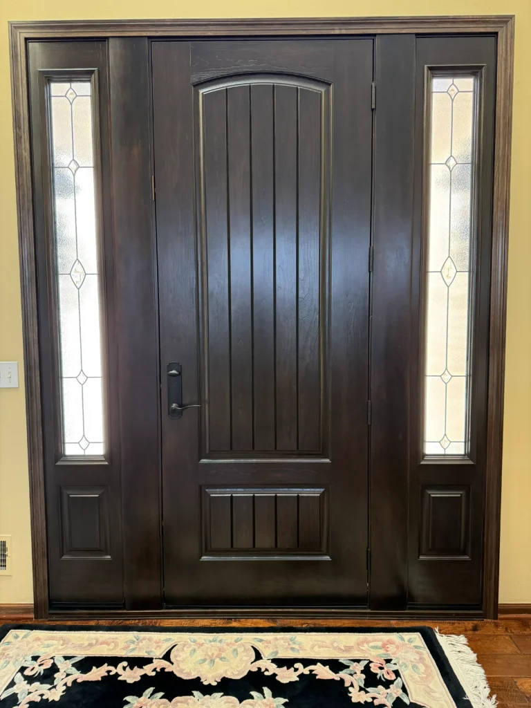 New wood entry door with decorative glass sidelights