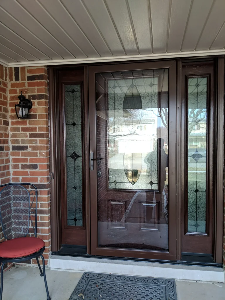 New entry door with decorative glass and sidelights