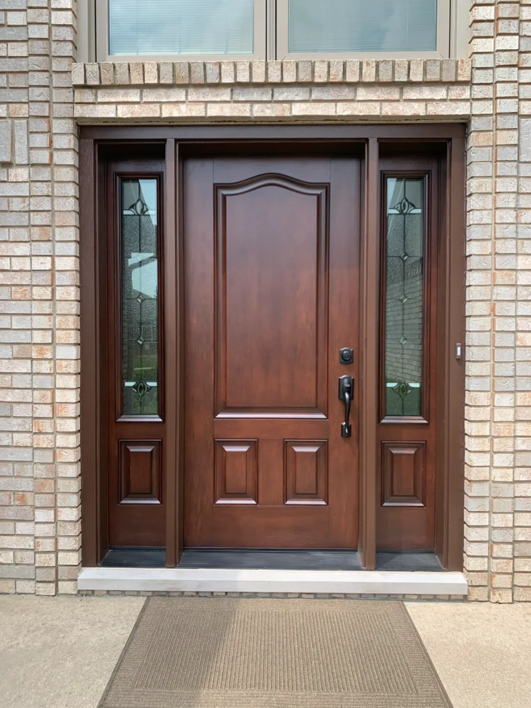New wood entry door with decorative glass sidelights