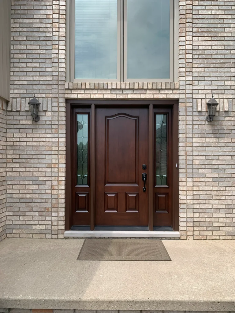 New wood entry door with decorative glass sidelights