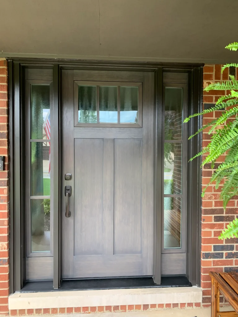 New gray wood entry door with sidelights