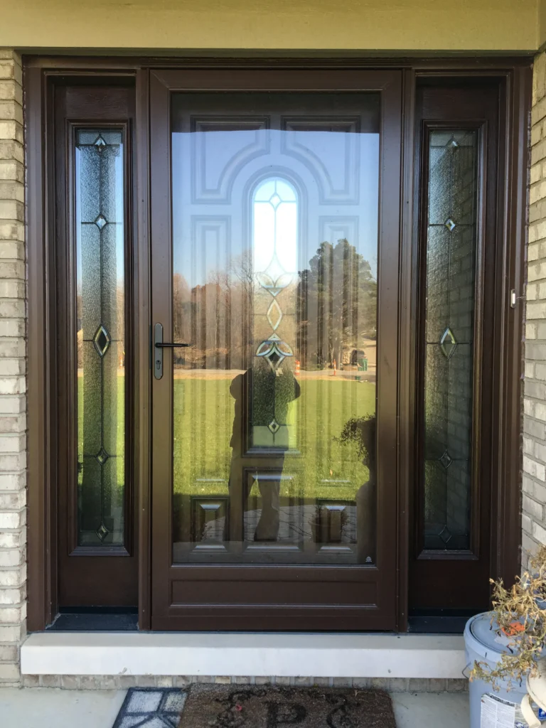 New wood entry door with decorative glass and sidelights